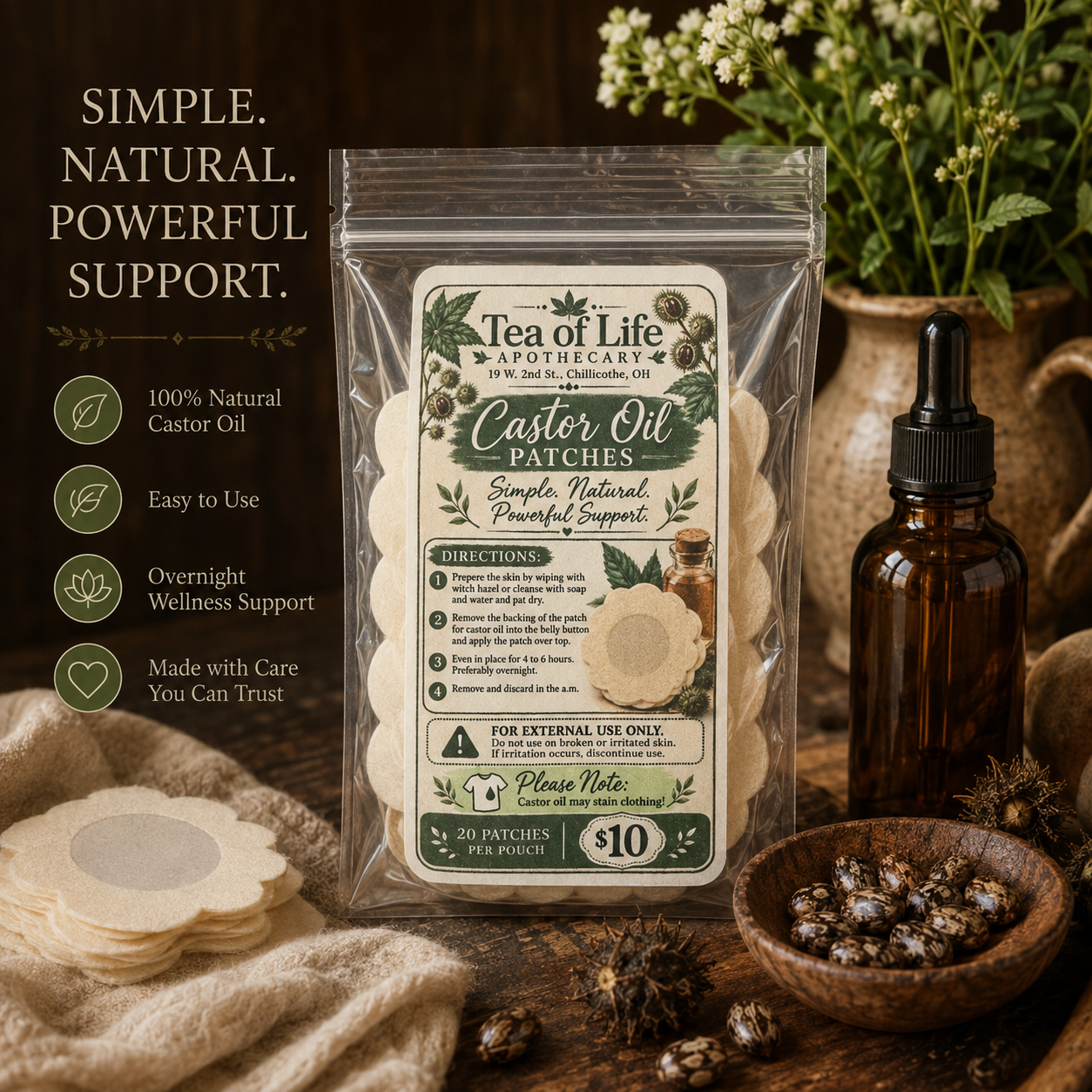 Tea of Life Apothecary Castor Oil Patches in a resealable pouch, displayed in a rustic botanical setting with castor seeds, herbs, and castor oil.
