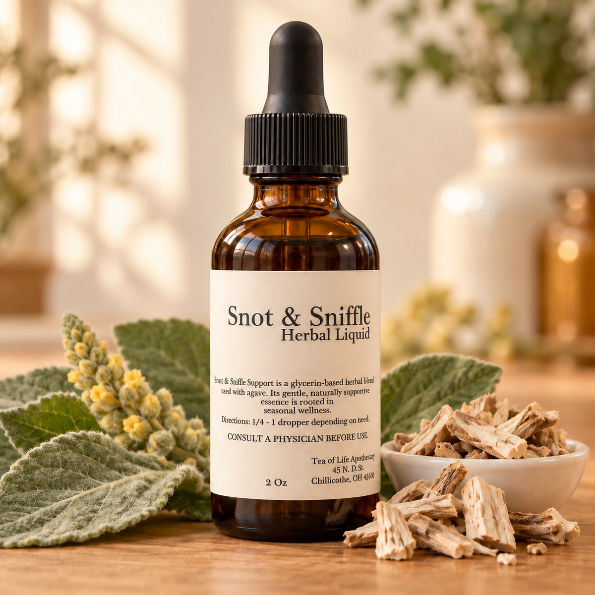 Tea of Life Apothecary Snot & Sniffle Support Herbal Liquid in a 2 oz amber dropper bottle, styled with mullein leaves and marshmallow root.
