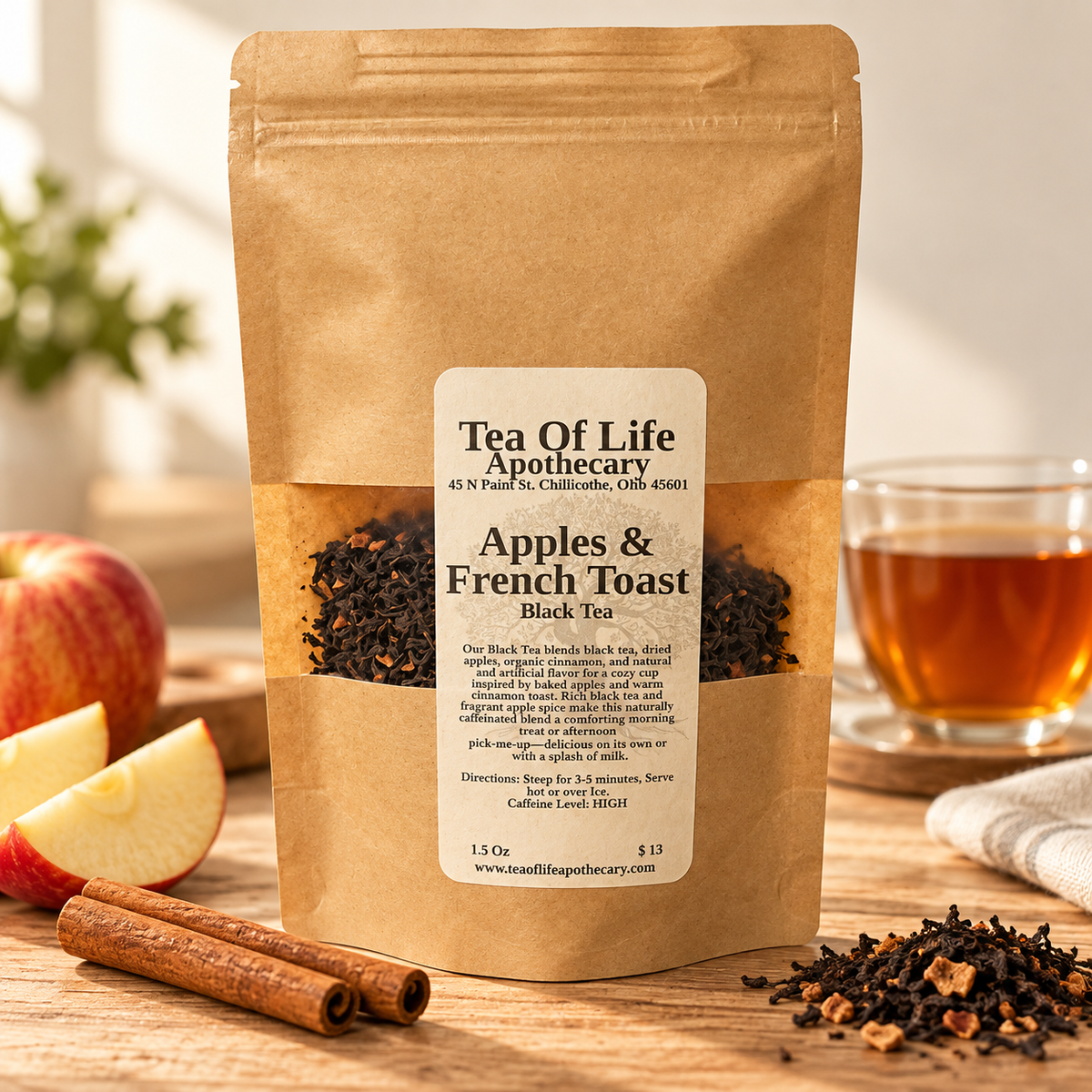 Tea of Life Apothecary Apples & French Toast Black Tea pouch with apple slices, cinnamon sticks, loose leaf tea, and a cup of amber tea.