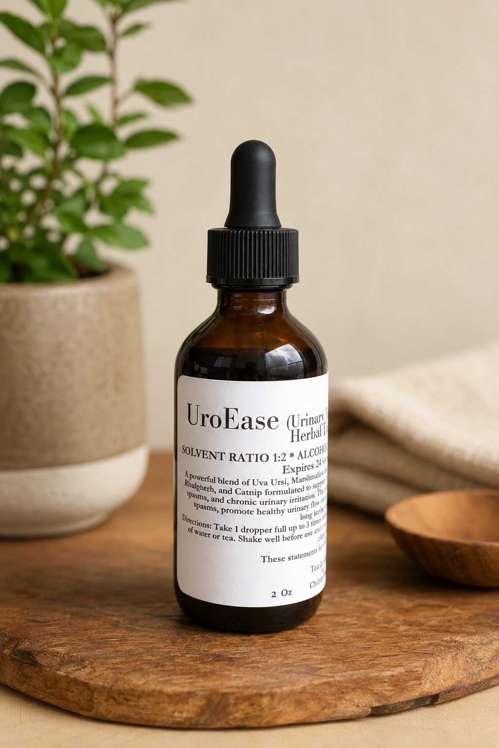UroEase urinary herbal tincture in an amber glass dropper bottle displayed on a rustic wooden surface with soft natural lighting and herbal wellness decor in the background.