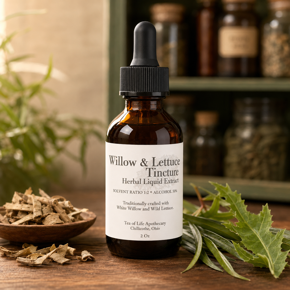 Tea of Life Apothecary Willow and Lettuce herbal tincture displayed with white willow bark and fresh wild-lettuce leaves.