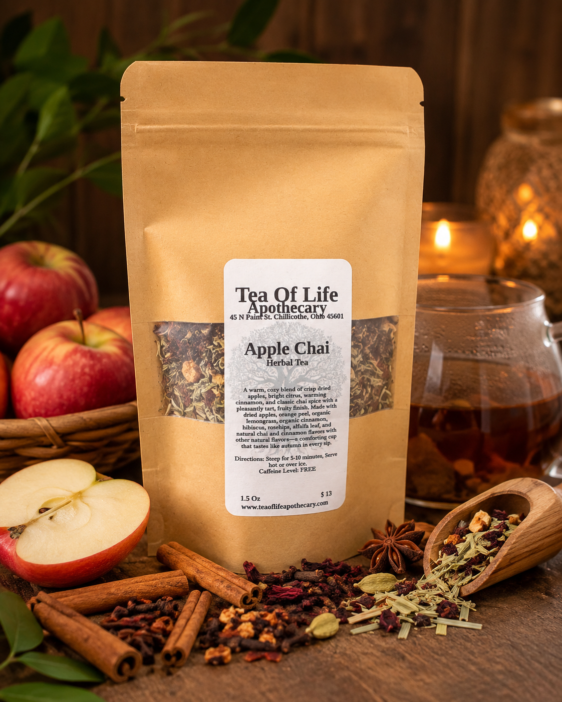 Apple Chai Herbal Tea by Tea of Life Apothecary, a caffeine-free loose leaf blend with dried apples, cinnamon, orange peel, lemongrass, hibiscus and warming chai spices, pictured with fresh apples and chai spices.