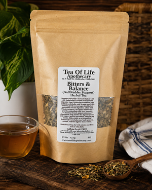 Bitters and Balance Gallbladder Support Herbal Tea by Tea of Life Apothecary displayed with a warm cup of herbal tea and digestive-support herbs on a rustic wooden table.