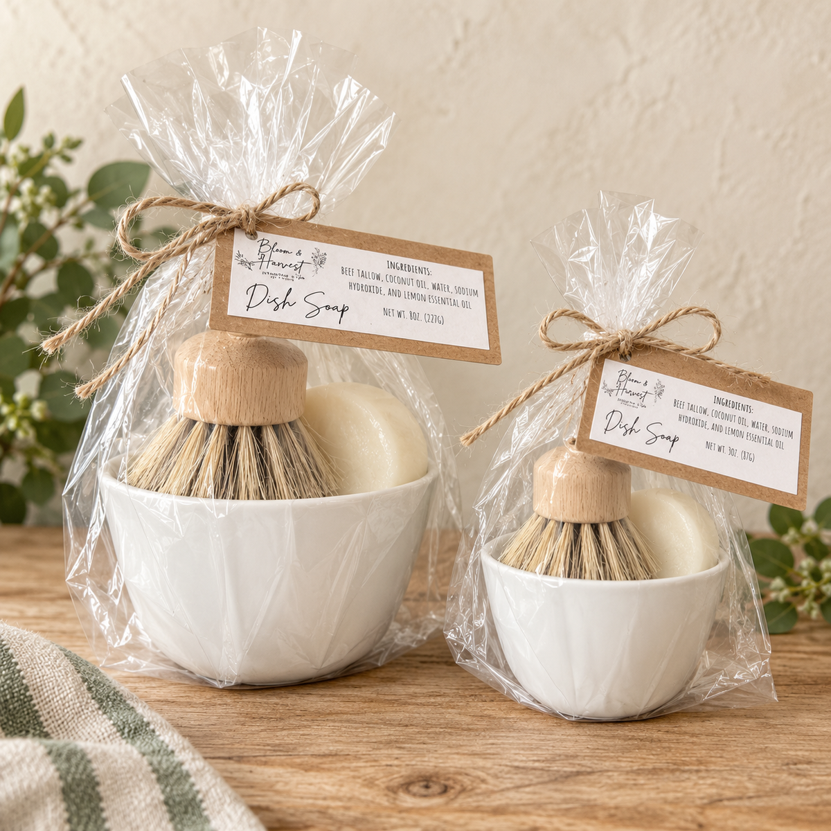Bloom & Harvest solid dish soap sets in two sizes, featuring lemon tallow dish soap, a natural-bristle wooden scrub brush and a white ceramic bowl in gift-ready packaging.