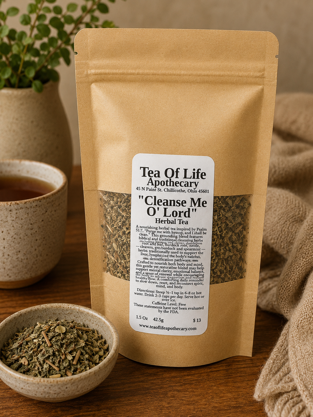 Cleanse Me O’ Lord Herbal Tea by Tea of Life Apothecary displayed in a warm rustic apothecary setting with loose cleansing herbs, ceramic tea cup, and soft natural lighting to highlight gentle detox, lymphatic, and digestive support.