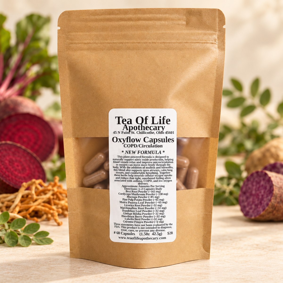 Tea of Life Apothecary Oxyflow Capsules in a kraft pouch, photographed with beetroot, leafy herbs, cordyceps, and purple sweet potato in a warm, softly lit setting.