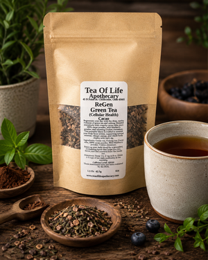 ReGen Green Tea by Tea of Life Apothecary displayed in a rustic setting with loose leaf tea, cacao nibs, blueberries, and a warm cup of tea to promote cellular health, energy, and antioxidant support.
