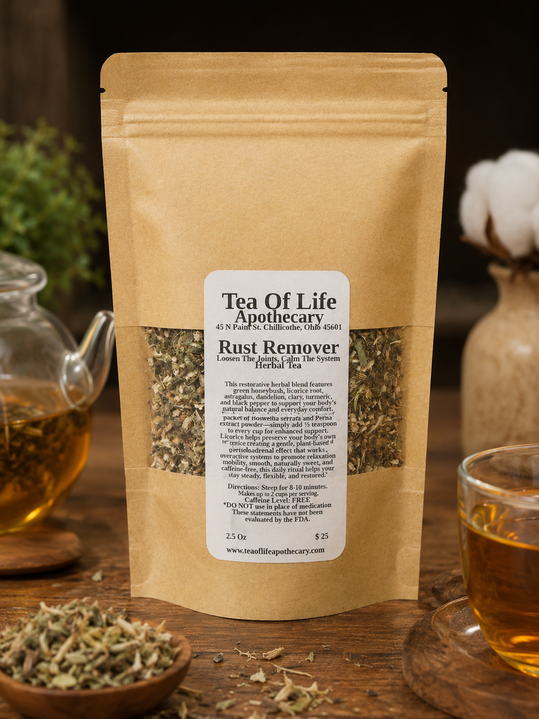 Rust Remover Herbal Tea by Tea of Life Apothecary displayed in a rustic product setting with a glass teapot and herbal tea cup on a wooden table. This caffeine-free herbal blend supports joint comfort, mobility, inflammation balance, and nervous system calm with ingredients like turmeric, licorice root, devil’s claw, honeybush, and black pepper.