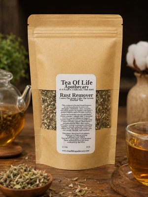 Rust Remover Herbal Tea by Tea of Life Apothecary displayed in a rustic product setting with a glass teapot and herbal tea cup on a wooden table. This caffeine-free herbal blend supports joint comfort, mobility, inflammation balance, and nervous system calm with ingredients like turmeric, licorice root, devil’s claw, honeybush, and black pepper.