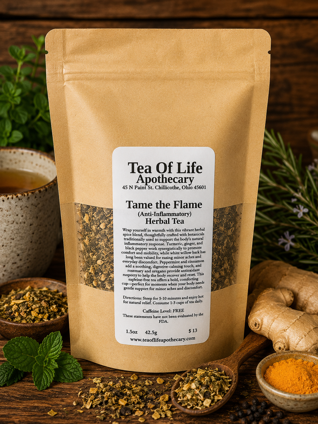 Tame the Flame Anti-Inflammatory Herbal Tea by Tea of Life Apothecary displayed with ginger, turmeric, peppermint, and herbal ingredients in a warm rustic wellness setting
