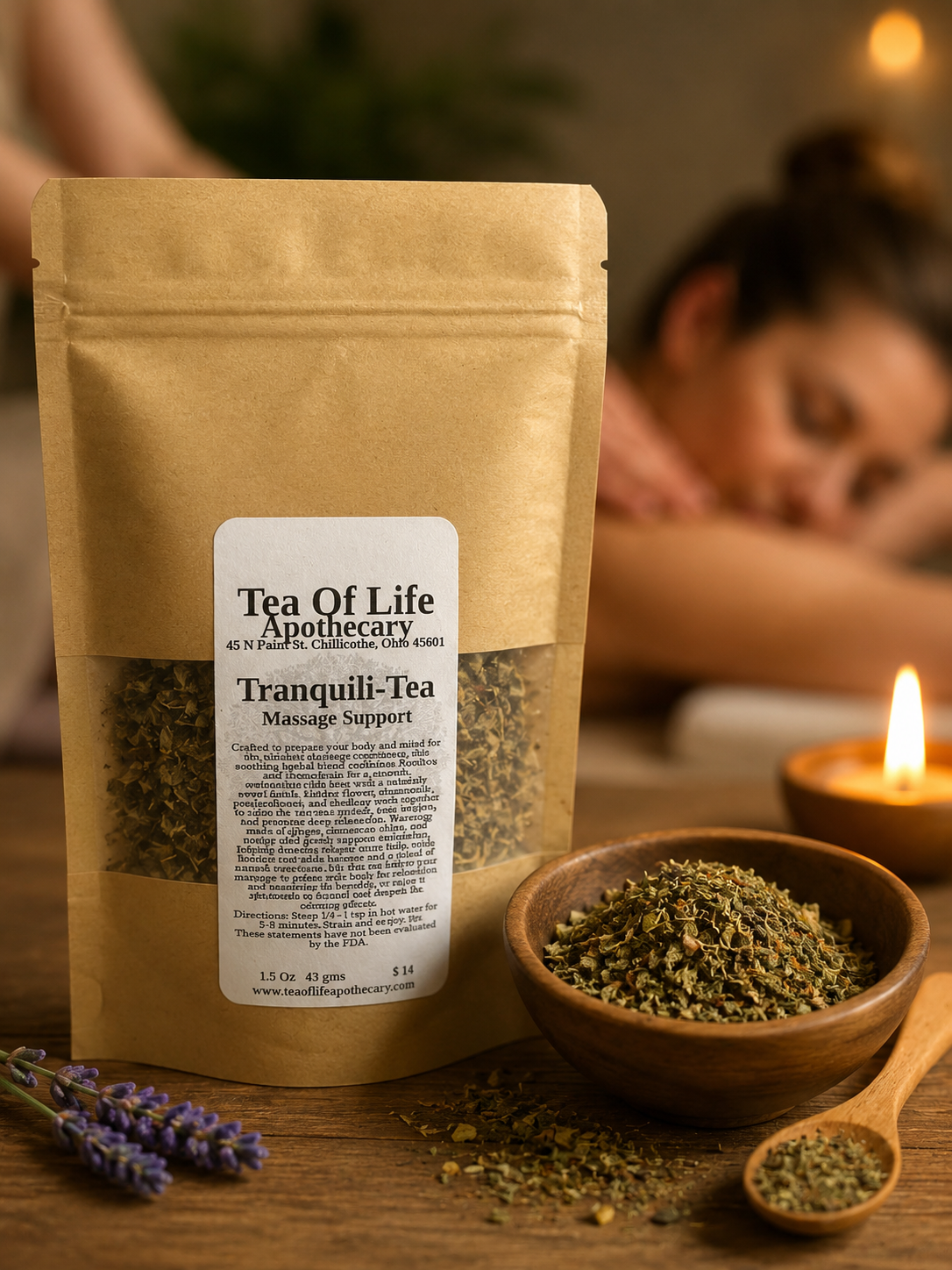 Tea of Life Apothecary Tranquili-Tea Massage Support herbal tea pouch displayed with loose herbs, lavender, and a wooden spoon on a rustic table, with a softly blurred spa massage in the background. A calming herbal blend designed to support relaxation before or after massage.