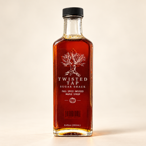 Twisted Tap Fall Spice Infused Maple Syrup in a tall 250 mL glass bottle on an ivory background.