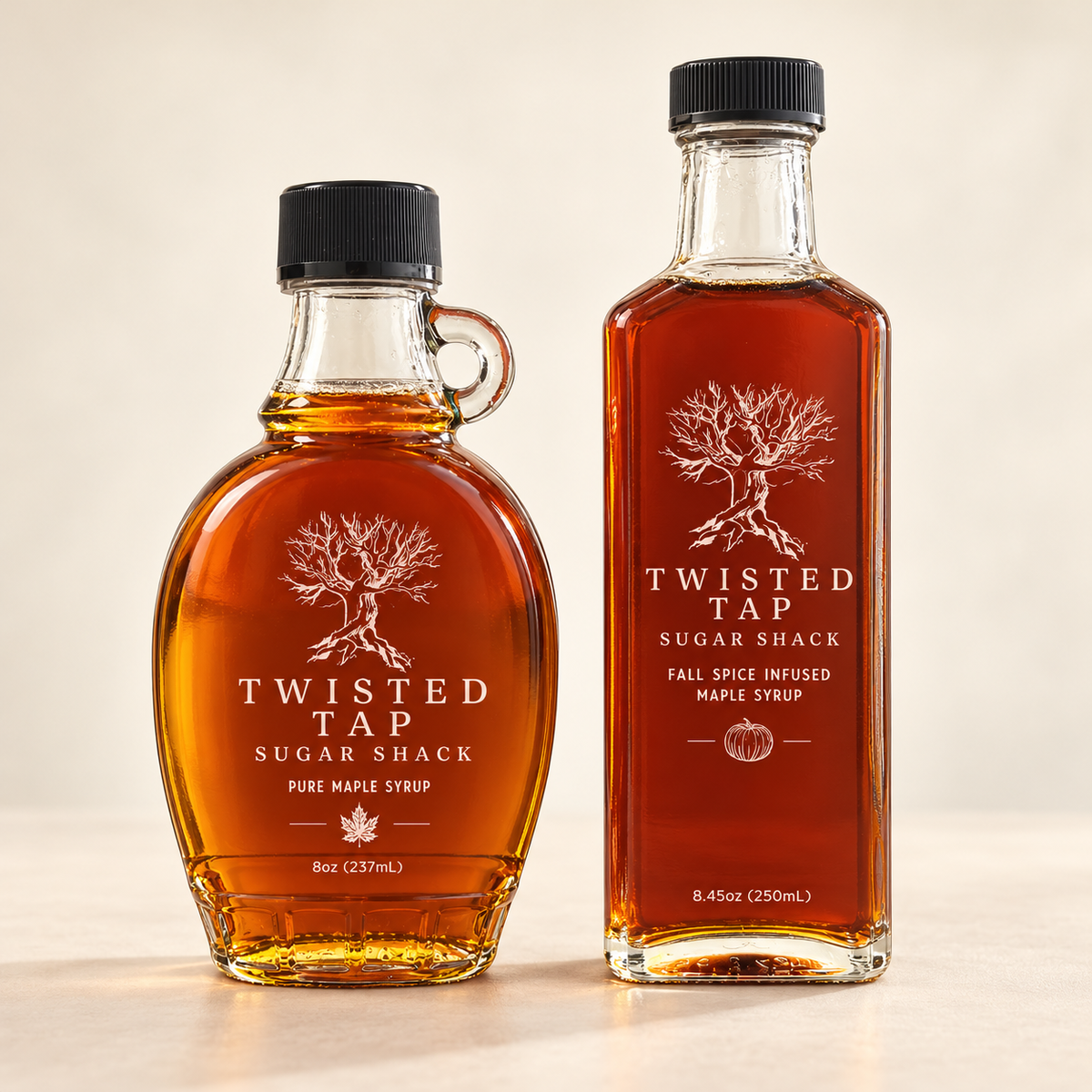 Twisted Tap Regular Pure Maple Syrup and Fall Spice Infused Maple Syrup bottles on a warm ivory background.