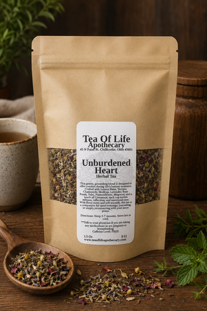 Tea of Life Apothecary Unburdened Heart Herbal Tea in a kraft pouch with loose leaf herbs including lemon balm, vervain, chamomile, skullcap, lavender, rose petals, tulsi, and passionflower. Caffeine-free herbal tea crafted to promote relaxation, emotional balance, and peaceful reflection.